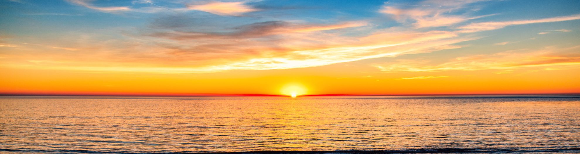 Image of sunset over the ocean in Carlsbad, California